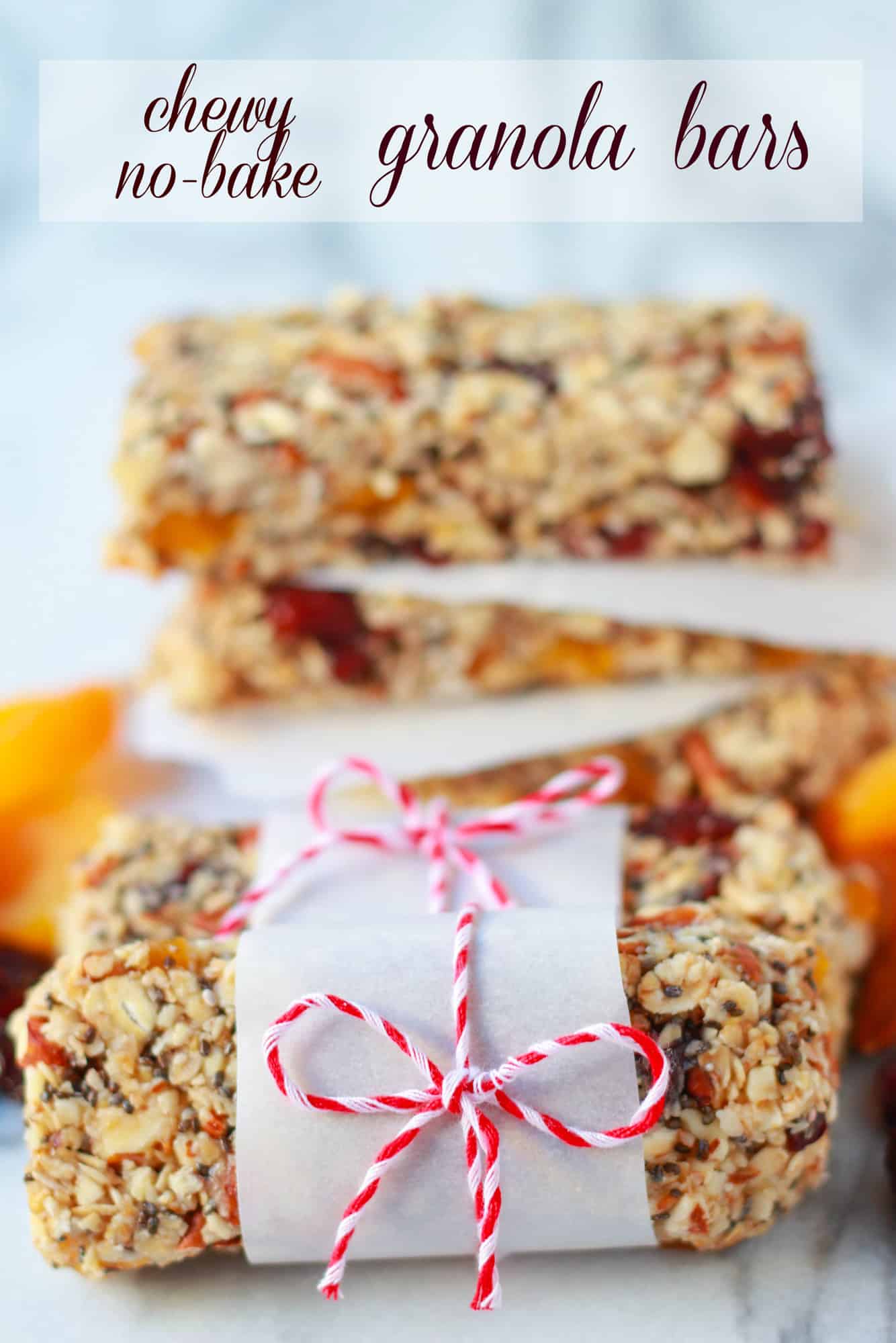 Granola bars on pieces of parchment paper.