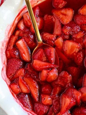 Juicy roasted strawberries in a baking dish.