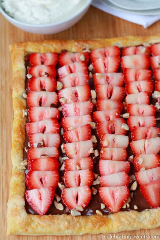 Fruit tart on a wooden board.