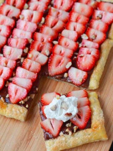 Fruit tart on a wooden board.