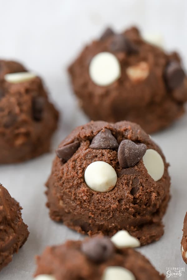 Chocolate cookie dough ball topped with chocolate chips.