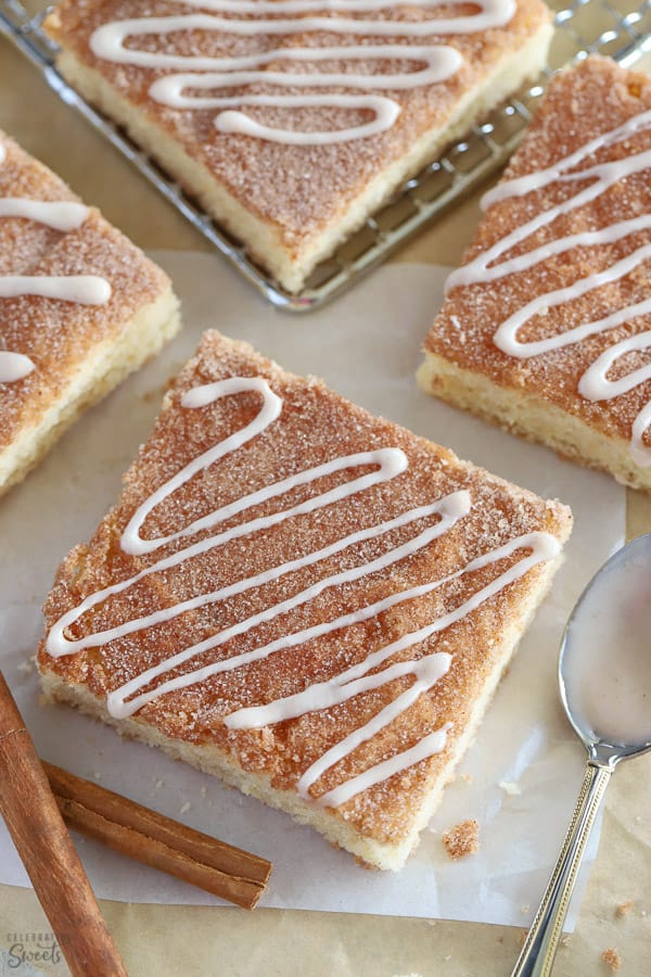 Cookie bar topped with cinnamon sugar and drizzled with white icing.