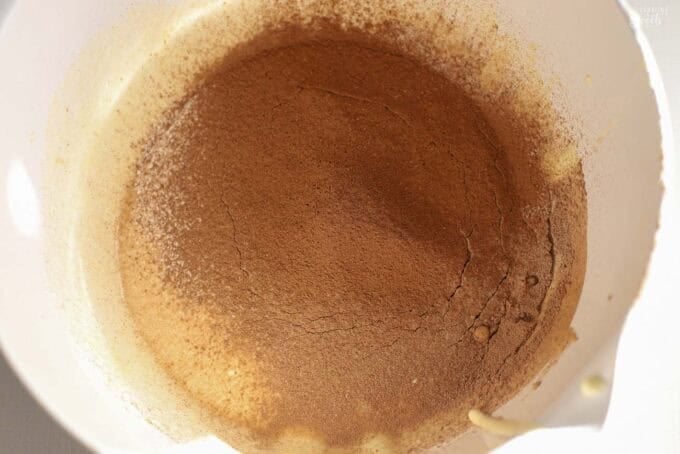 Brownie pudding batter in a white bowl.