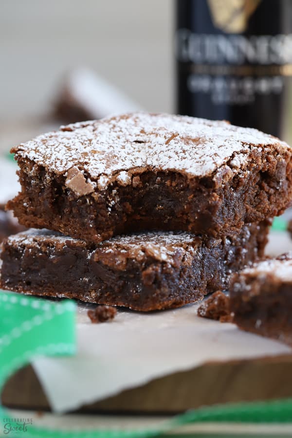 Two Guinness Brownies topped with powdered sugar.