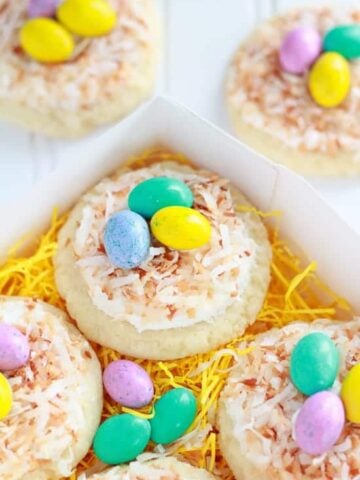 Sugar cookies topped with coconut and egg shaped candies.