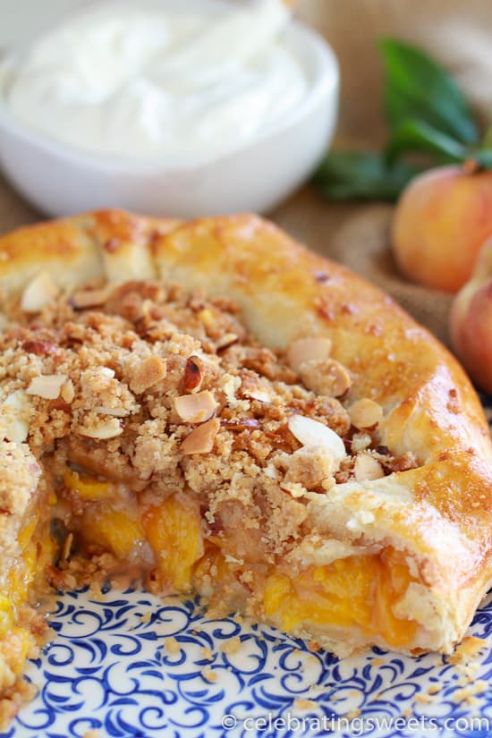 Peach galette on a blue and white plate.