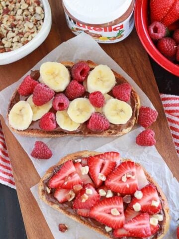 Bread topped with chocolate spread and fresh fruit.