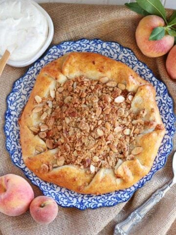Peach galette on a white and blue plate.
