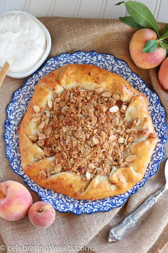Peach galette on a white and blue plate.