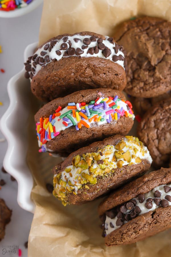 Four round ice cream sandwiches in a white serving dish.