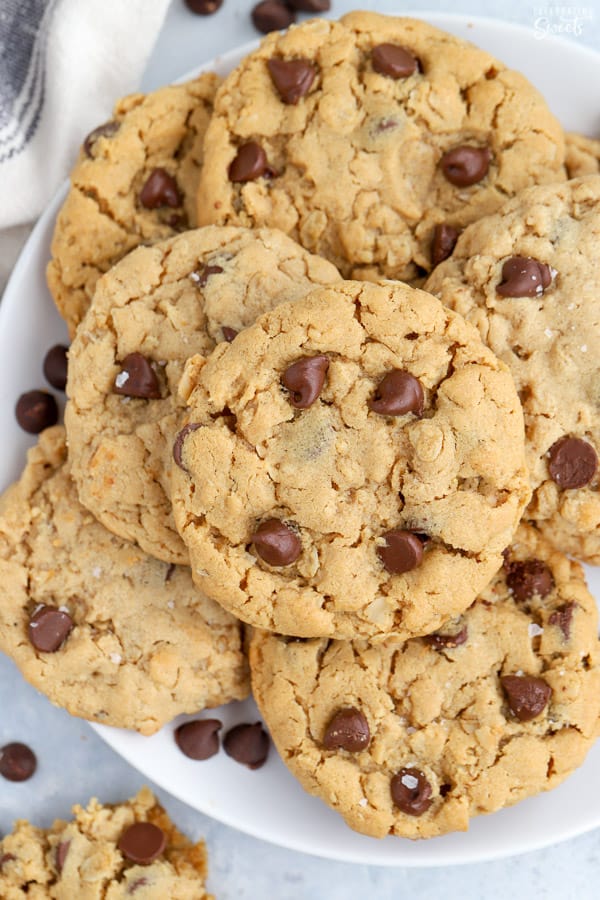 White plate filled with Peanut Butter Oatmeal Chocolate Chip cookies. 