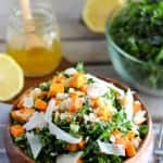 Kale salad in a wooden bowl.