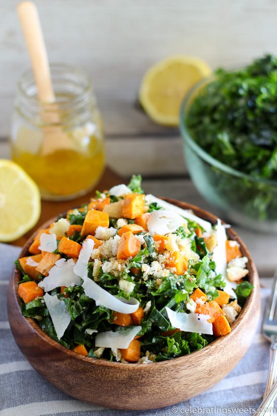 Kale and sweet potato salad in a wooden bowl.