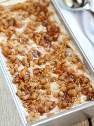 Apple pie ice cream in a metal loaf pan.