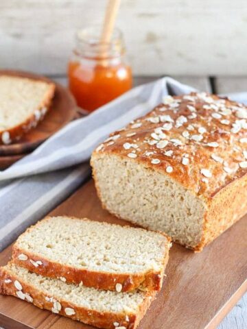 Loaf of bread on a wooden cutting board.