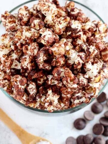 Chocolate popcorn in a glass bowl.