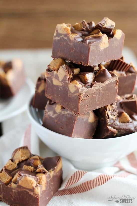 Bowl of fudge topped with peanut butter cups.