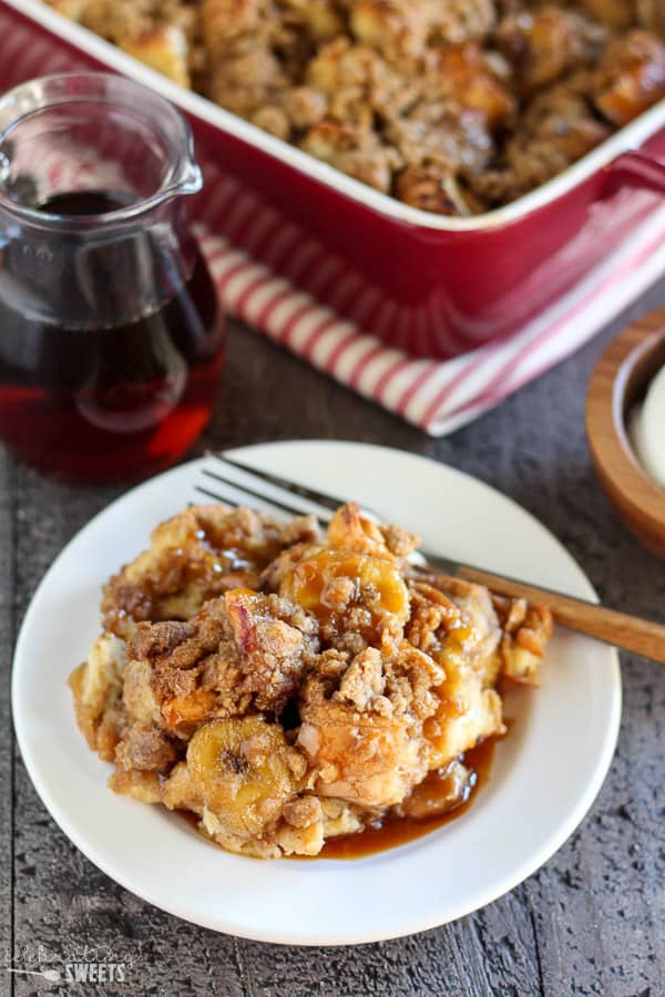 French toast casserole on a white plate with a fork.