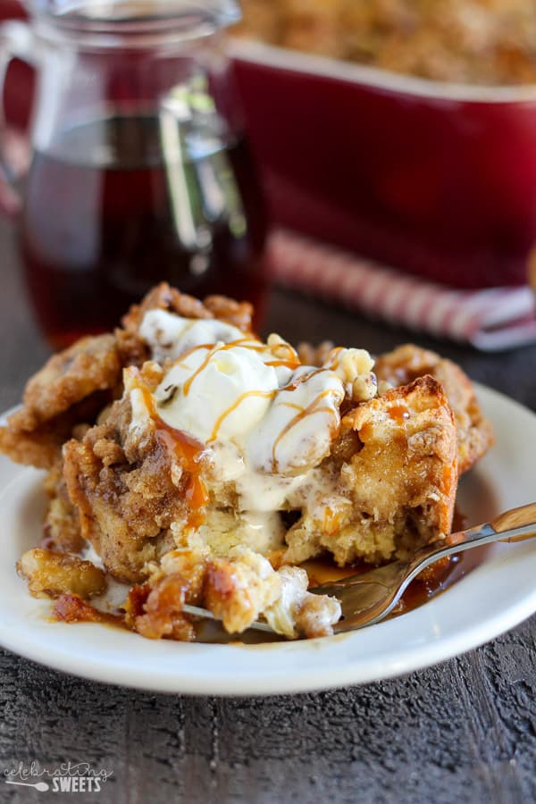 French toast casserole on a plate topped with whipped cream.
