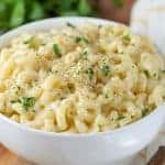 Bowl of macaroni and cheese in a white bowl.
