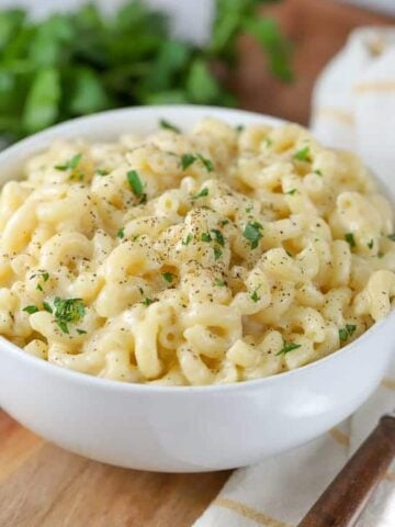 Bowl of macaroni and cheese in a white bowl.