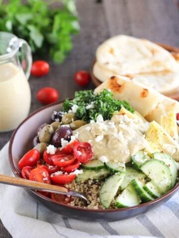 A bowl of salad with Hummus