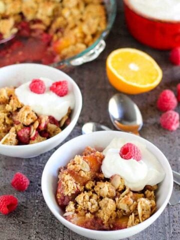 Fruit crisp in white bowls.