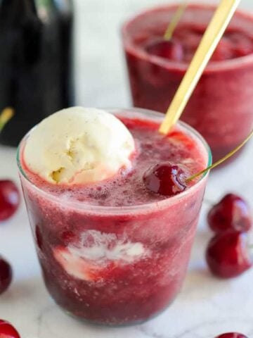 Cherry daiquiri topped with a scoop of vanilla ice cream.