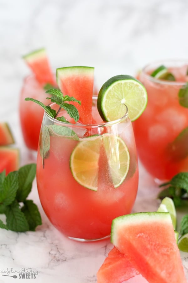 Watermelon mojito garnished with lime and mint.