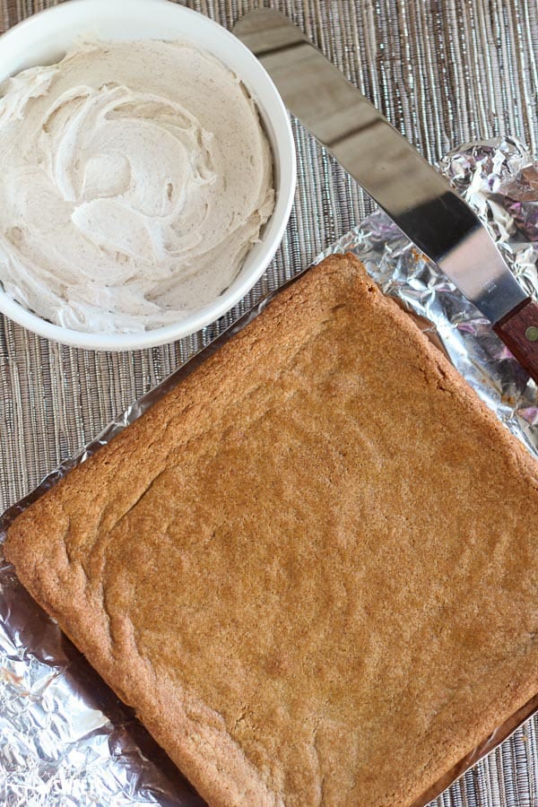Cookie bars and a bowl of frosting.