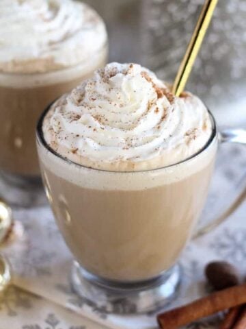 Eggnog latte topped with whipped cream.