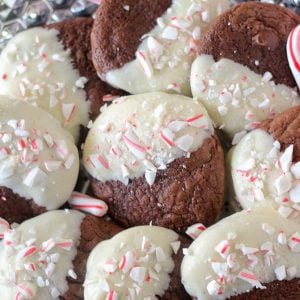 Plate of chocolate cookies dipped in white chocolate.