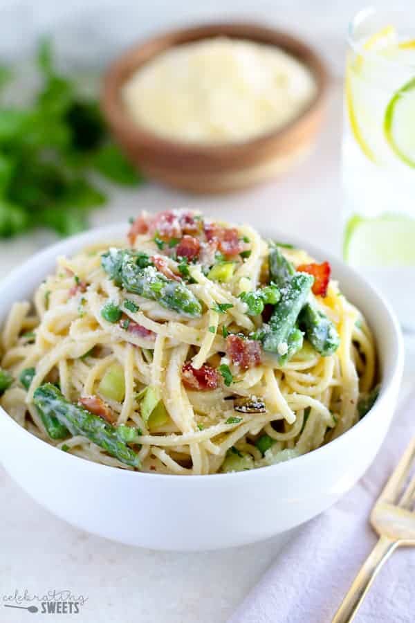 Bowl of pasta with asparagus and bacon.