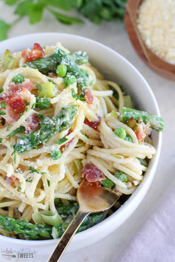 Bowl of pasta with asparagus and bacon.