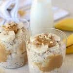 Overnight oats with peanut butter and sliced banana in a glass.