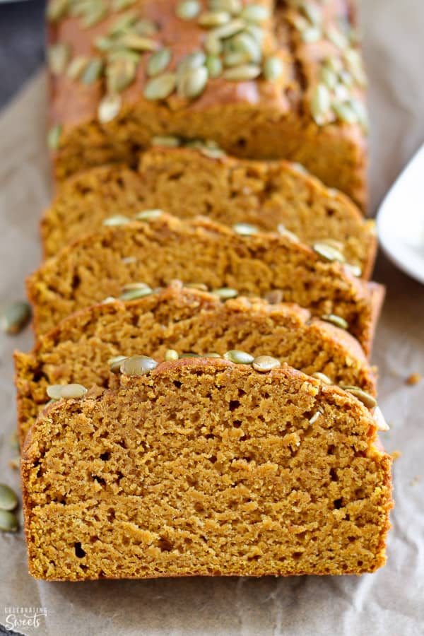 Slices of pumpkin bread on parchment paper.