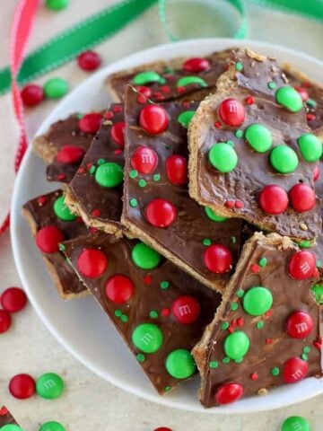 This festive Christmas Bark is easy and delicious! Layers of graham crackers, brown sugar toffee, peanut butter, and chocolate make this an addictive holiday treat.