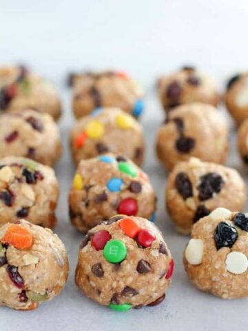 Energy bites topped with raisins, M&M's and dried fruit.