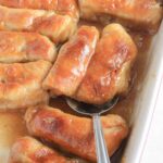 Apple dumplings in a baking dish.