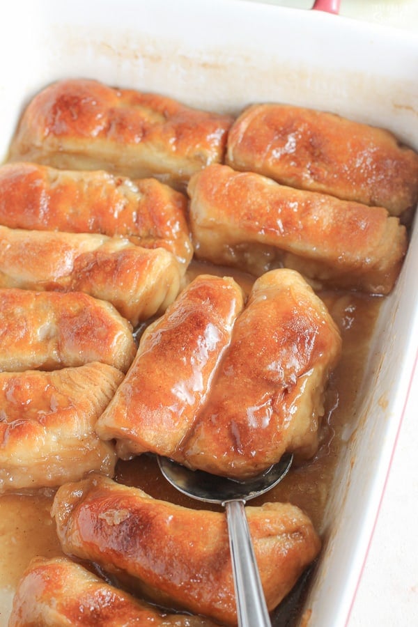 Apple dumplings in a baking dish.
