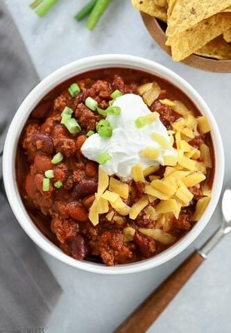 Beef Chili topped with cheese, sour cream and green onion