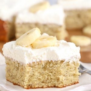 Slice of banana cake on a white plate.