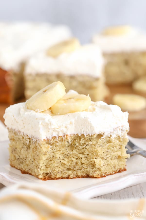 Slice of banana cake on a white plate.