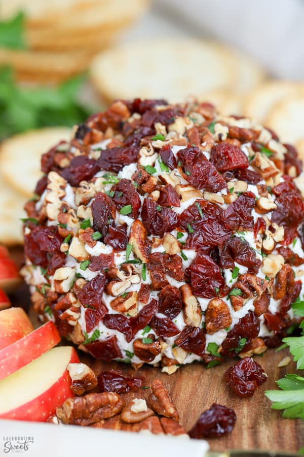 Cheese ball covered in dried cherries, pecans and parsley.