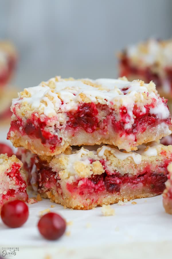 Two Cranberry Bars on parchment paper.