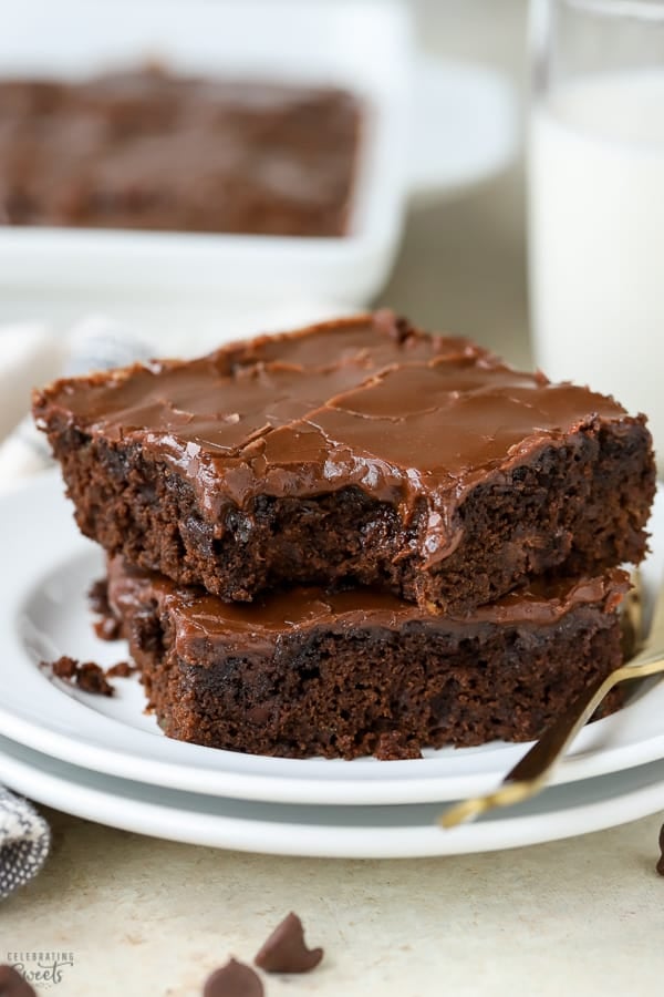 Two brownies on a white plate.