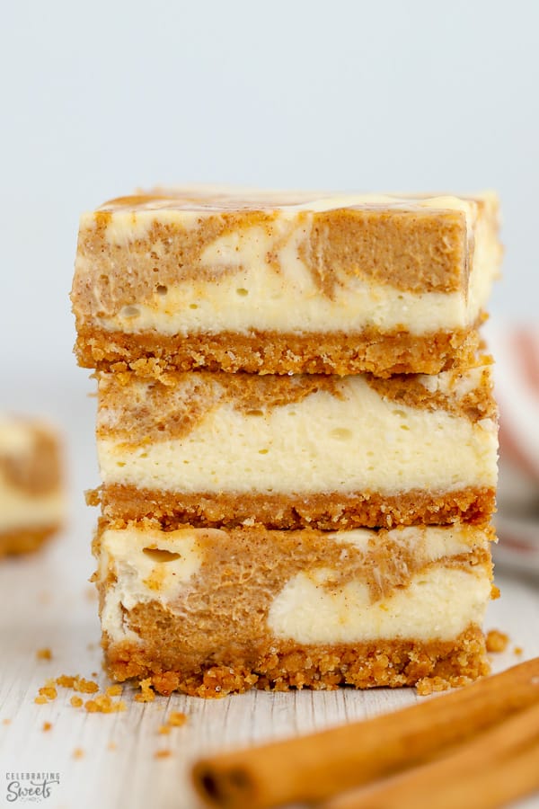 Stack of pumpkin cheesecake bars.