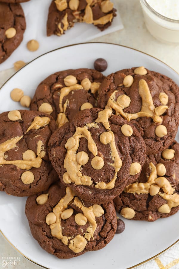 Chocolate cookies topped with peanut butter chips and a drizzle of peanut butter