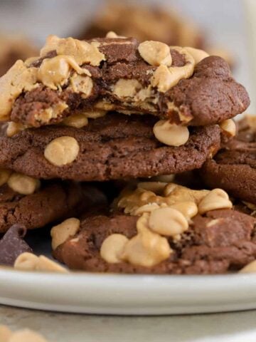Chocolate peanut butter cookies piled on a plate.