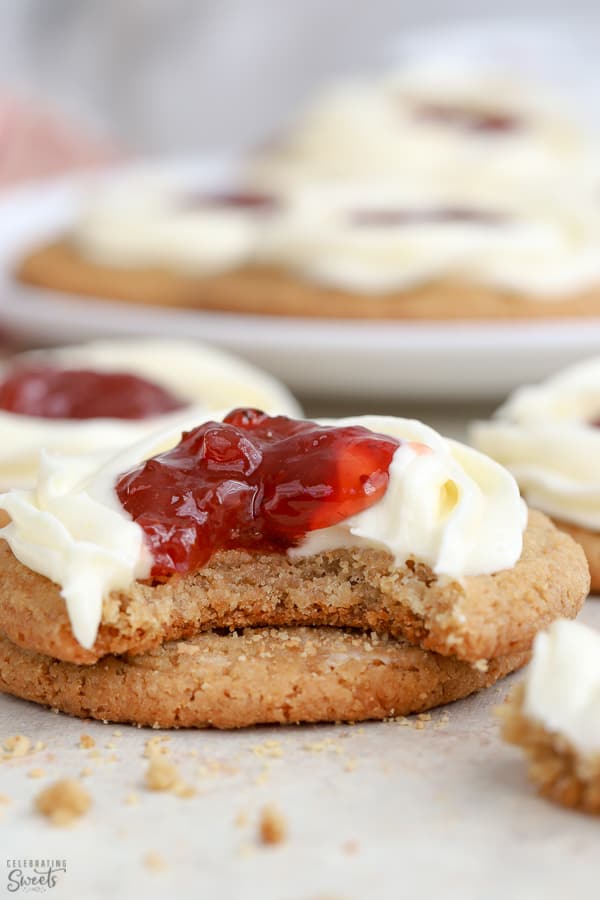 Cheesecake cookie with a swirl of frosting and jam in the center